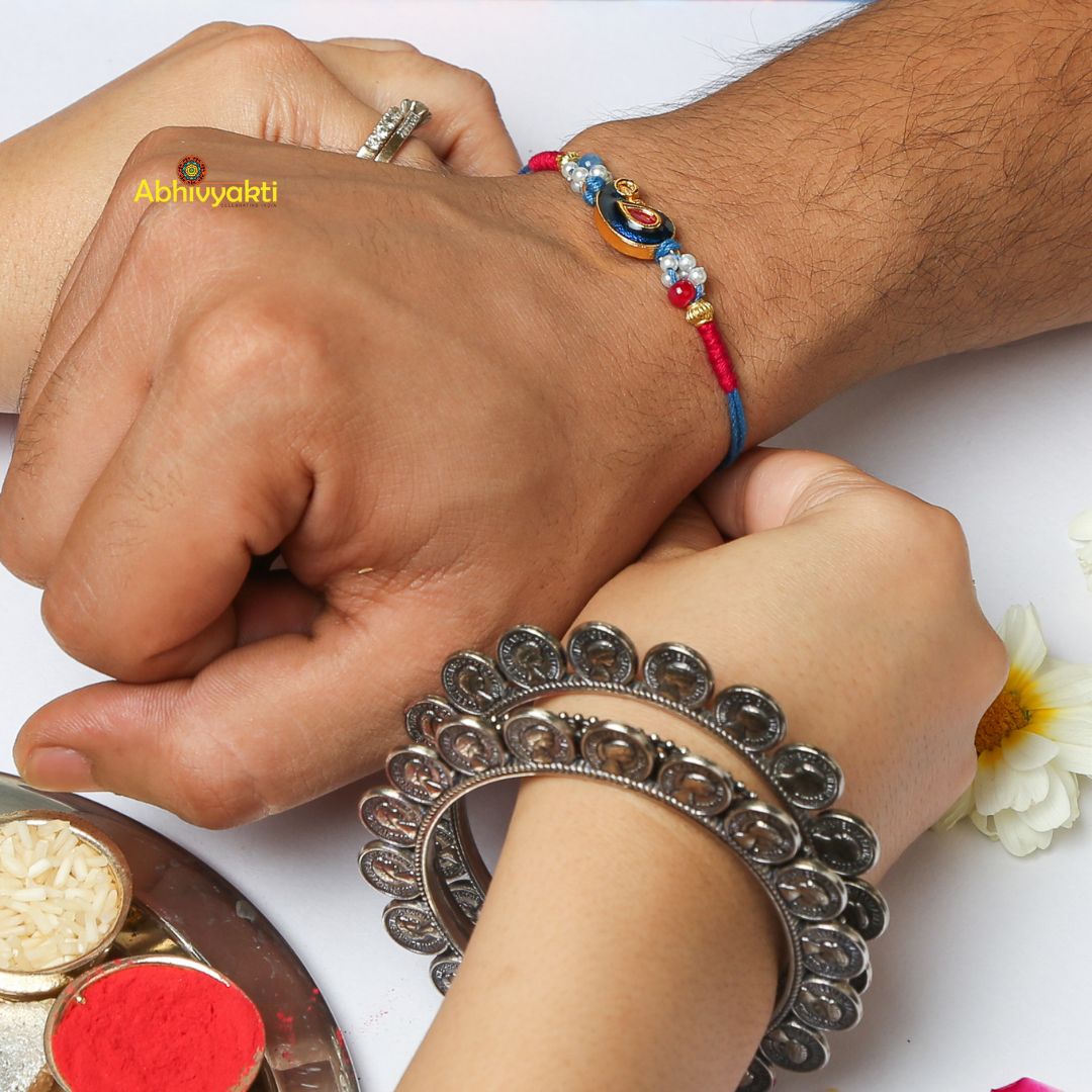 Celebrating rakshabandhan with sister tying beautiful Kundan PAISLEY DESIGN  rakhi to her brother