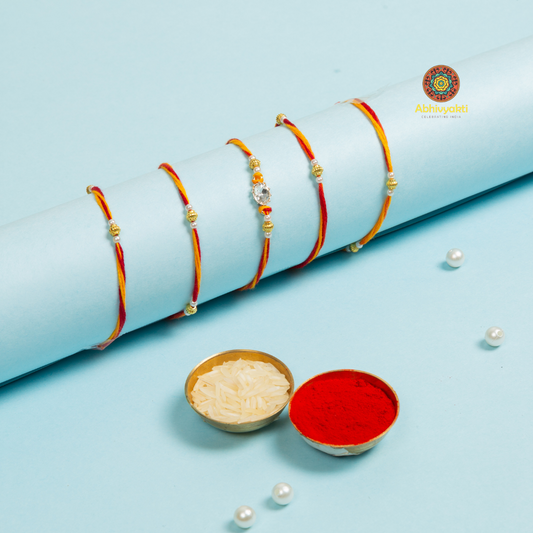 Rakhi bracelets, adorned with long thread, stone, and beads.