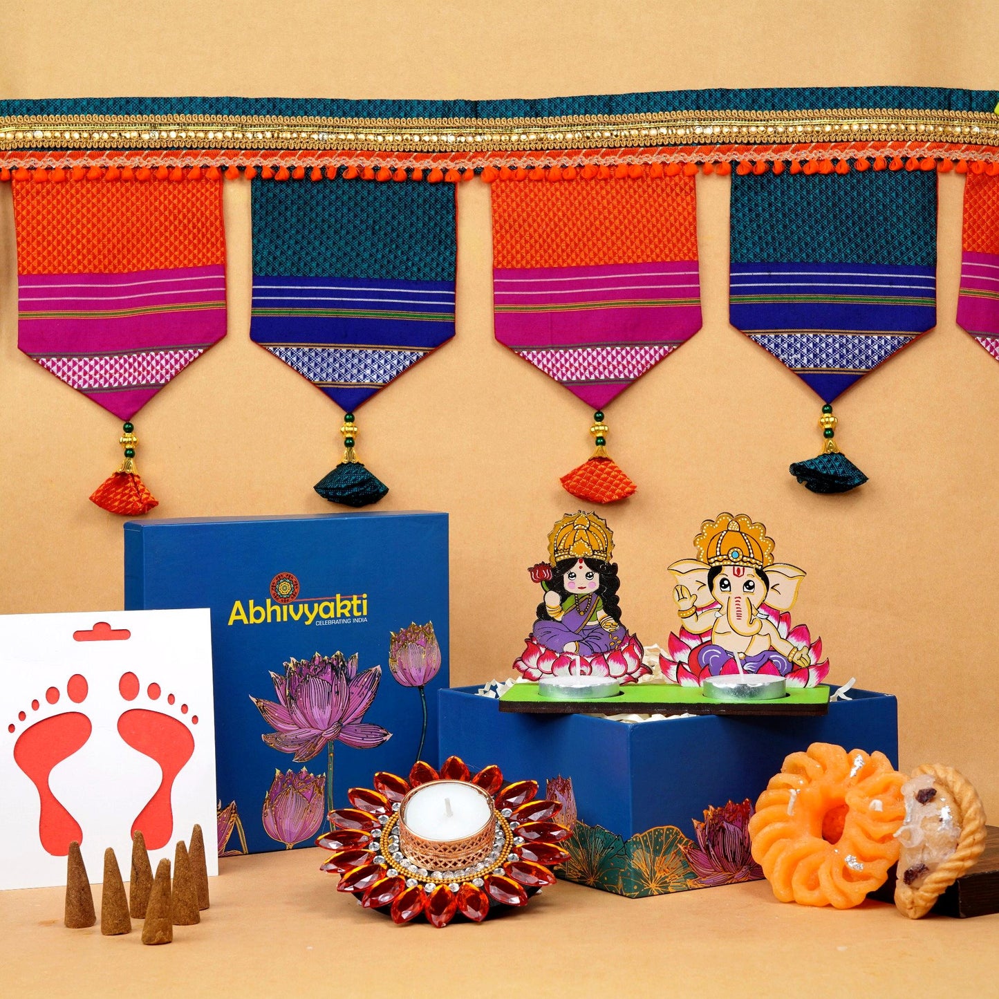 A festive Diwali hamper filled with an assortment of decorative items and treats. The hamper includes colorful floating diya, a box of mithai sweet candle, fragrant incense sticks, a small decorative toran, and festive Ganesh Lakshmi tealight. The items are beautifully arranged in a festive box with vibrant, rich colors and intricate detailing, evoking the spirit of Diwali celebrations. The hamper is a perfect gift for the festive vibe