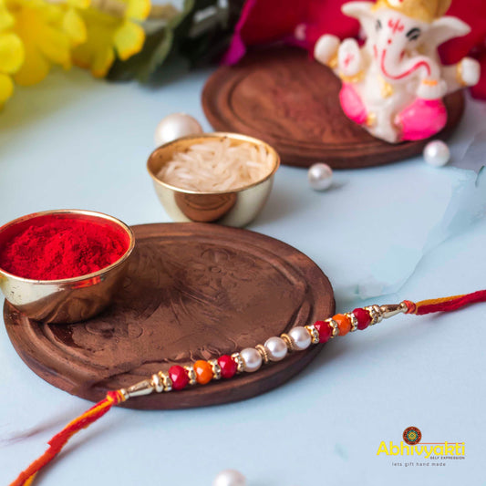 Colorful rakhi with beads, a symbol of love and protection between siblings, intricately designed with vibrant threads.