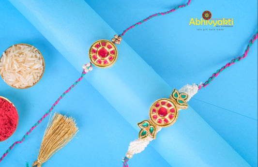 Rakhi lumba with stunning beads, stones, and unique design on blue background.