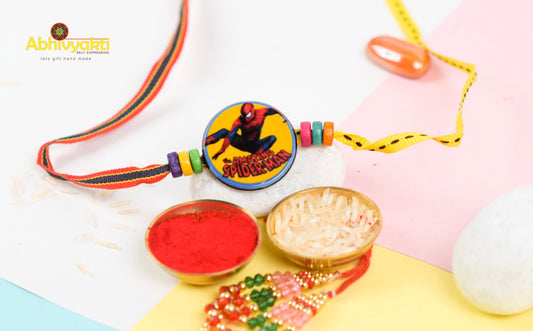 Rakhi for kids featuring Spiderman design and lovely beads.