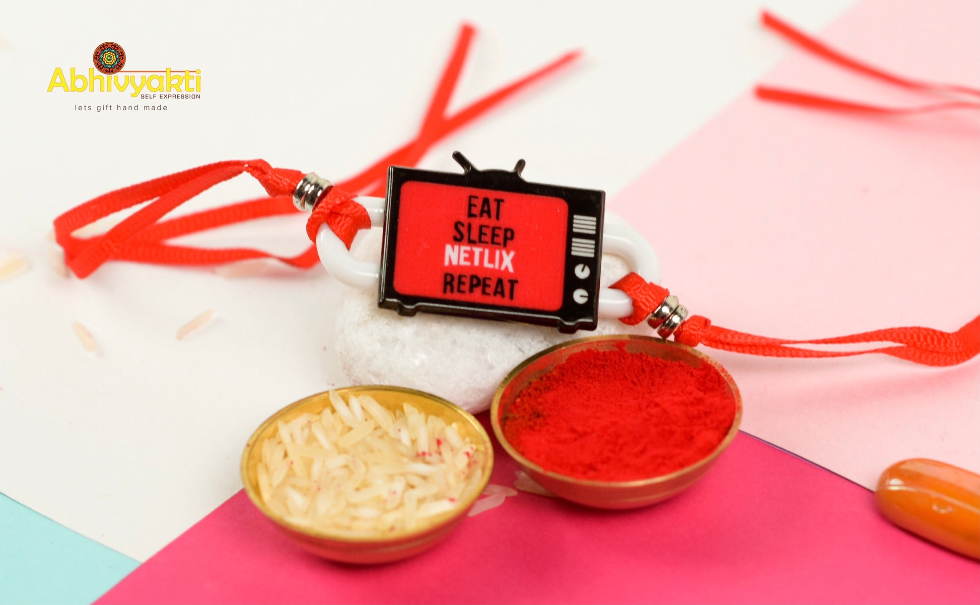  kids netflix Rakhi bracelet in red and white with red ribbon and beads.