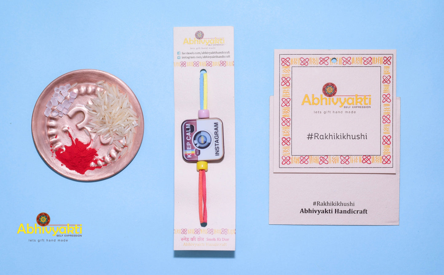 Rakhi for teens adorned with beads and a miniature instagram logo and seasonal greeting card