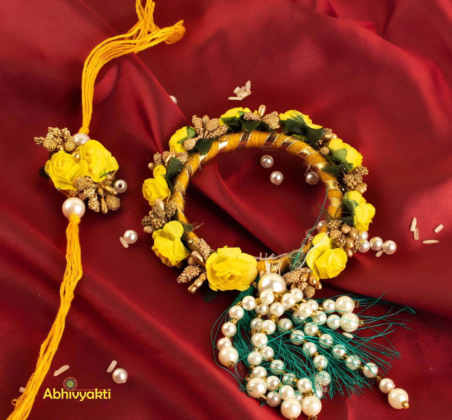 Yellow and white floral Rakhi lumba wreath adorned with pearls and beads.