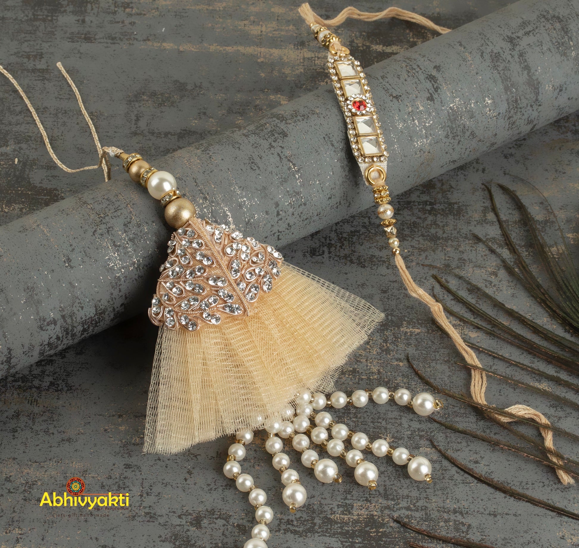 Beige tassel rakhi lumba adorned with pearls and beads.