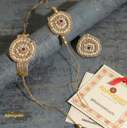 Image of a kundan Rakhi couple set with intricate golden embroidery, accompanied by a 3 piece Rakhi lumba featuring lovely beads and stones for Rakshabandhan festival