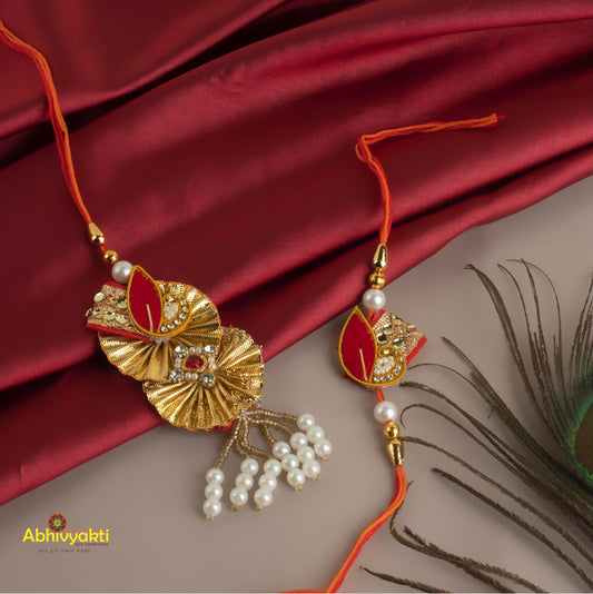 Beautifully crafted zari rakhi lumba featuring beads and stones.