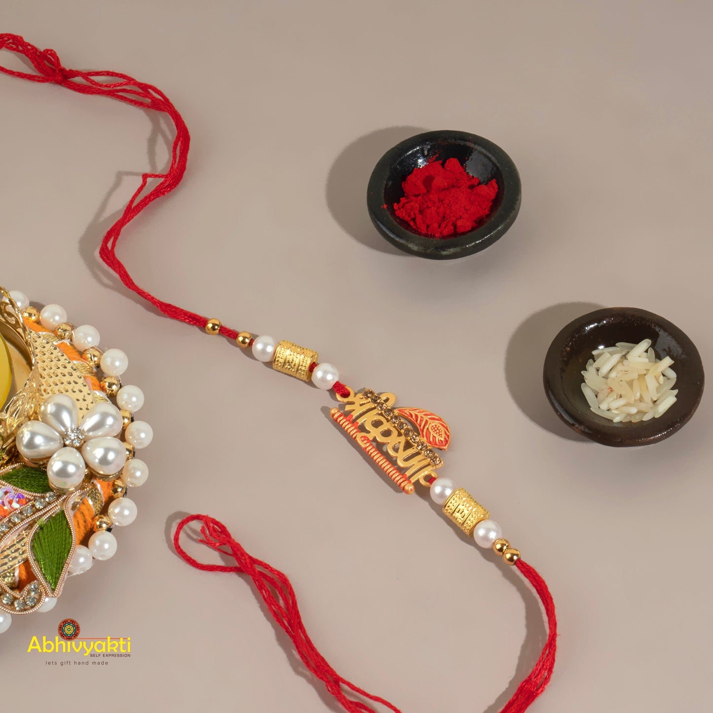 Shri Krishna design rakhi with a bowl of rice, symbolizing divine love and blessings.