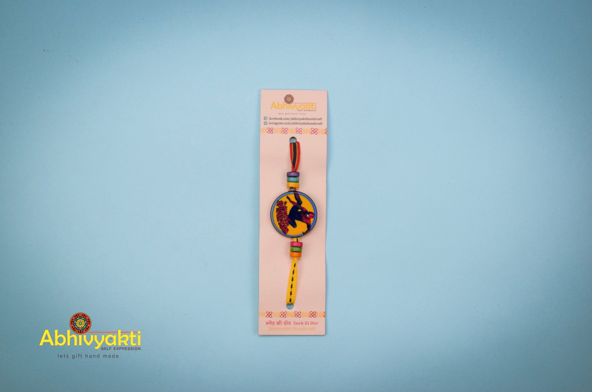 Rakhi for kids featuring Spiderman design and lovely beads.