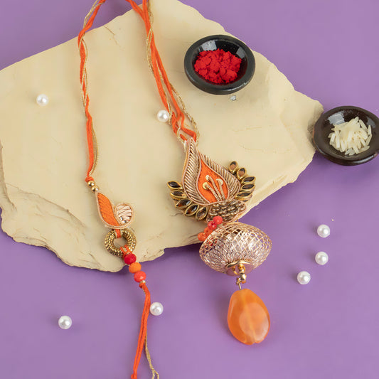 Gold and orange stone rakhi lumba, embellished with stones & beads.