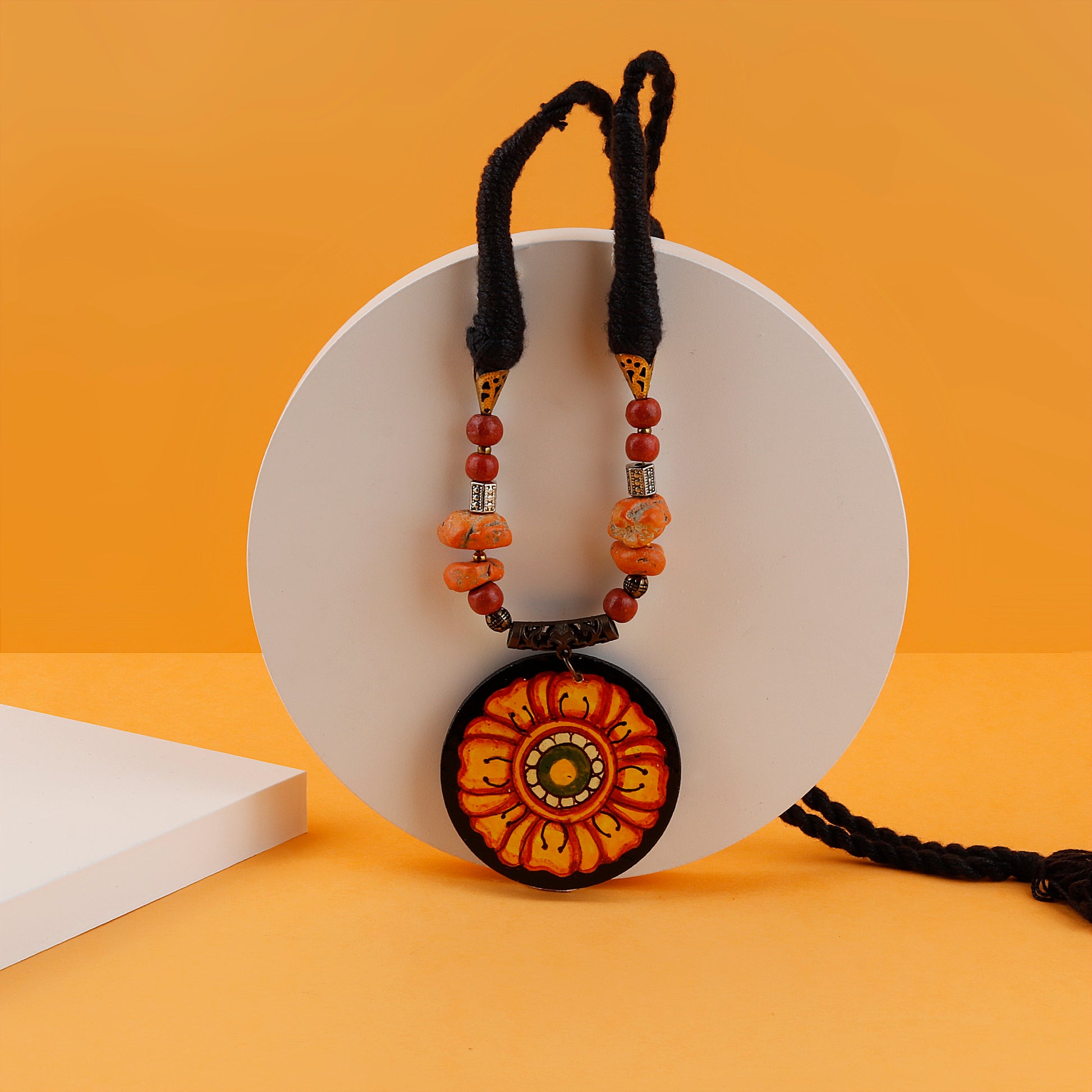 Beautiful necklace mural hand painted by Indian artists. The necklace pendant is circular and sunflower design is handpainted in it