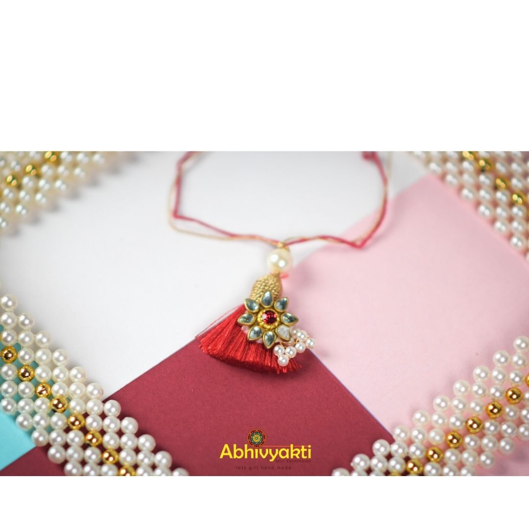 red  lumba with kundan and pearls 