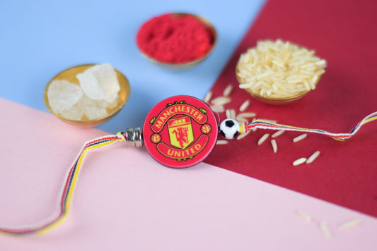 Kids Rakhi with Manchester United theme, accompanied by rice, roli, and beautiful beads