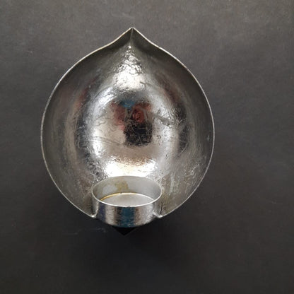 beautiful droplet shaped silver colored wall mounted tealight diya